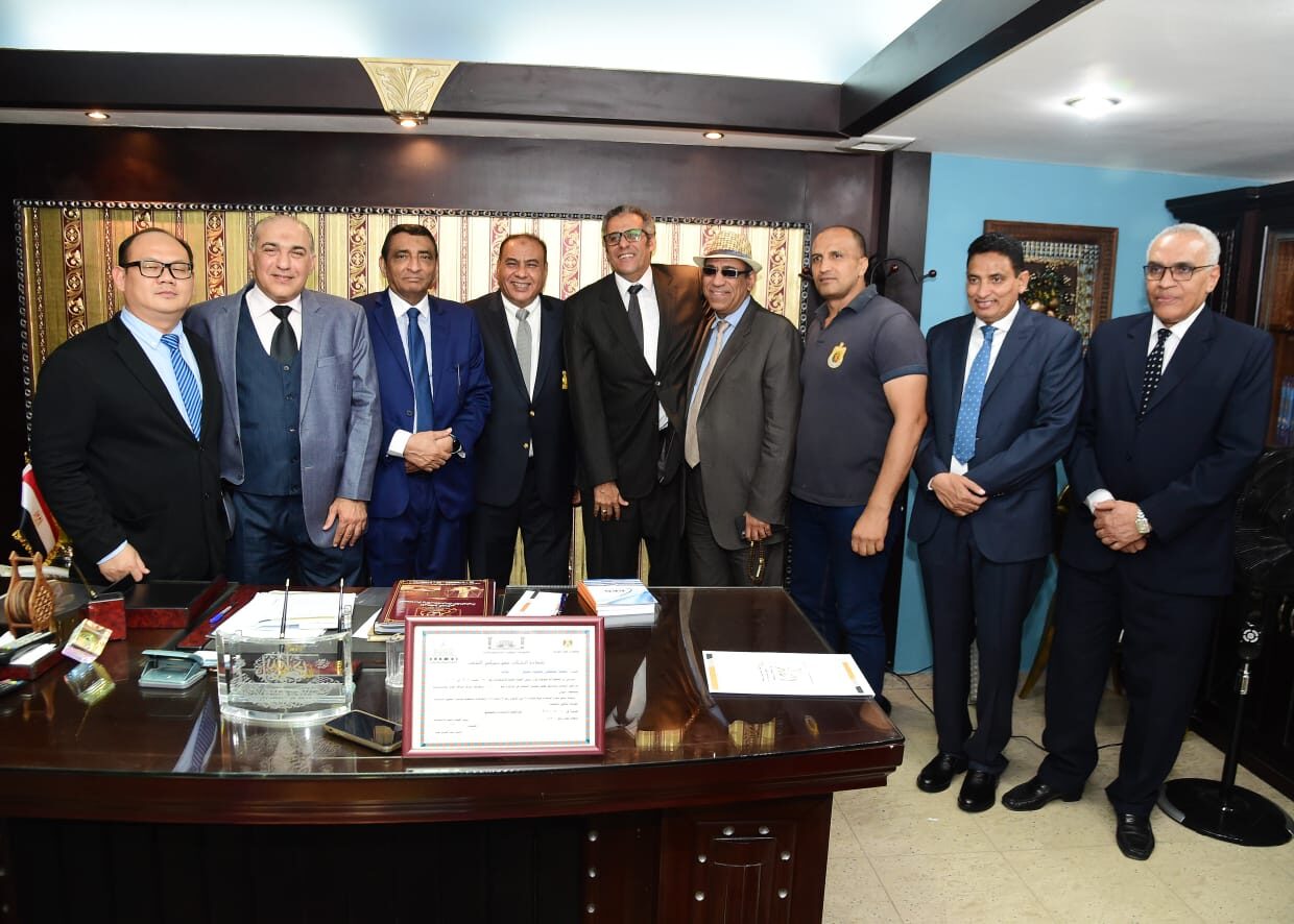 Attendees standing together at the office opening in Cairo.